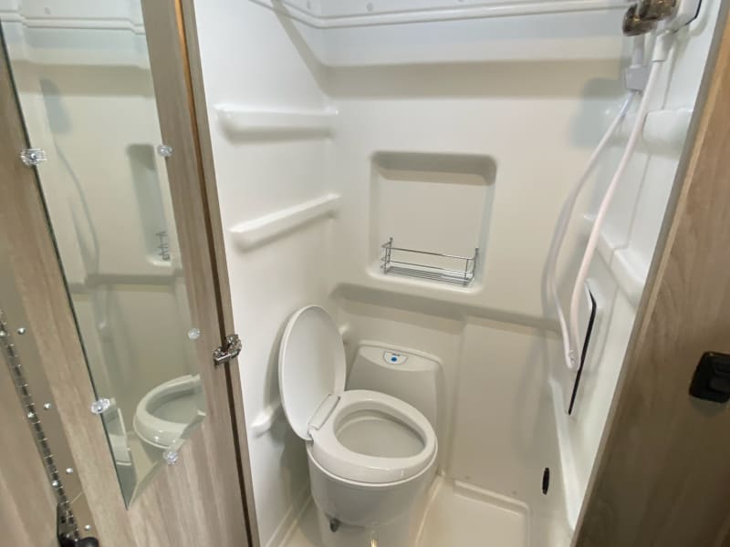 Wet bath with grey water cassette toilet.  Bathroom also warms and serves as a drying room for wet clothes