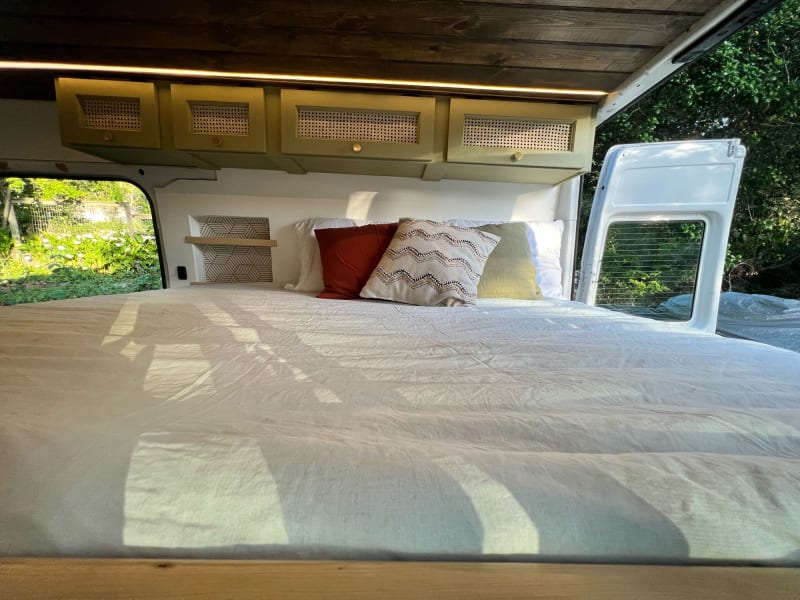 slides out to queen size foam mattress and has sliding bedroom window