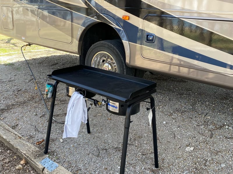 This is not an add on...it's included! 2 burner stove connects to the RV propane tank. Included with it is a griddle top!