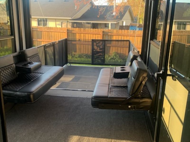 Bench seating in garage area. Converts to two queen beds.