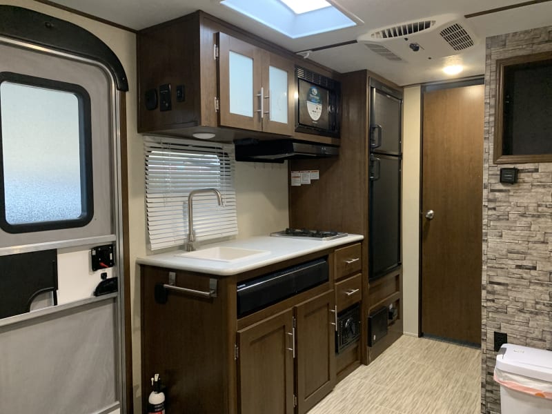 Kitchenette. Two-burner propane stove, microwave, large fridge and freezer.