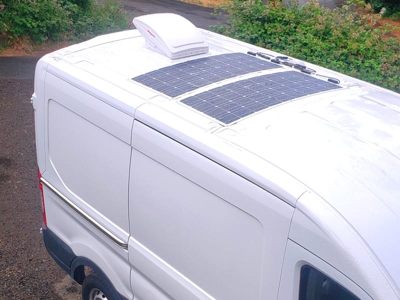 Solar panels to charge up your devices and maxxair fan to keep you cool and getting that fresh air all the time.