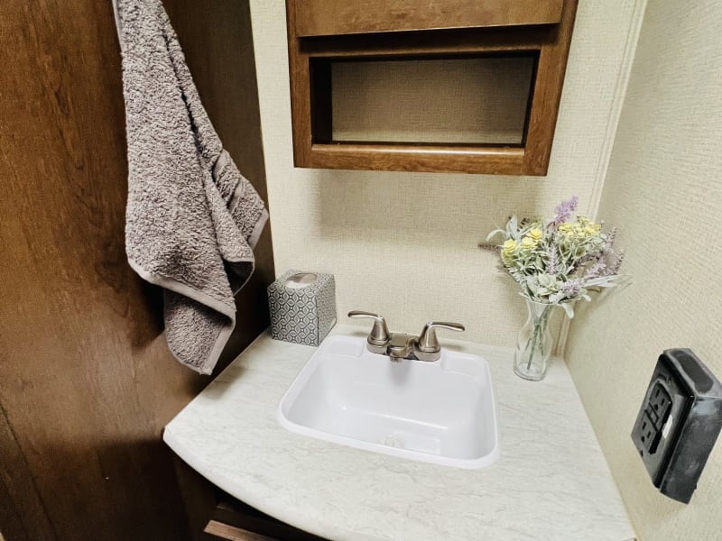 bathroom sink & storage above & below