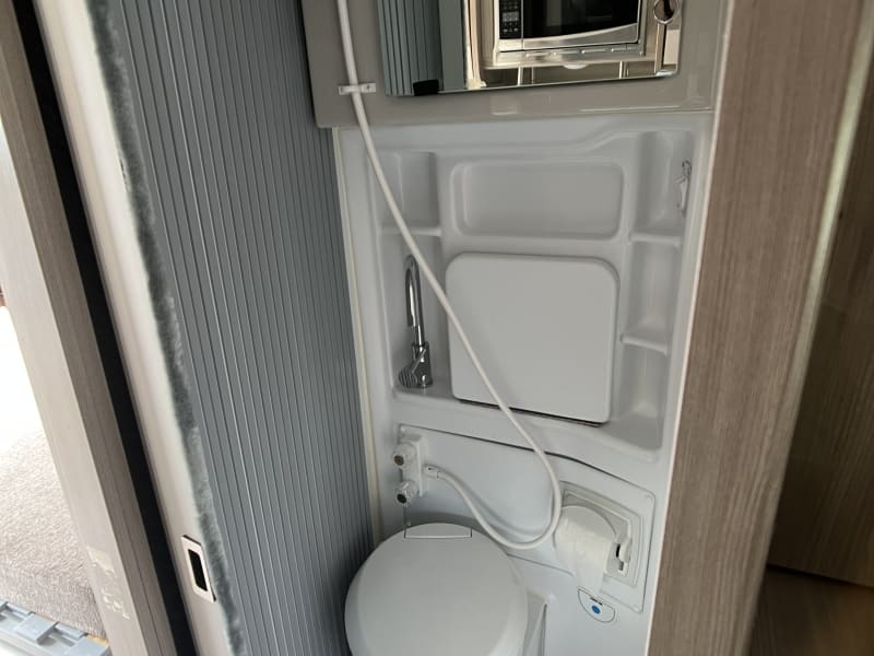 This is a combo toilet, sink and shower. 