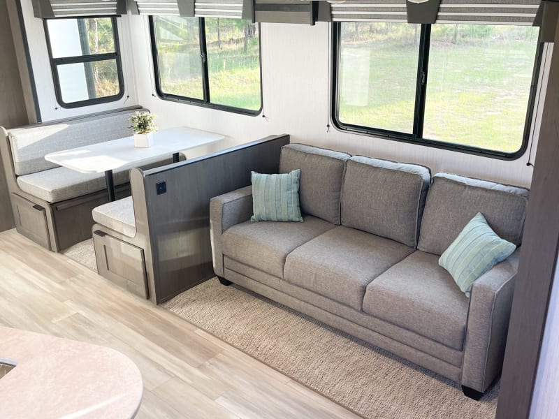 The super comfy couch folds out to a queen bed and the dinette converts to a sleeper as well!
