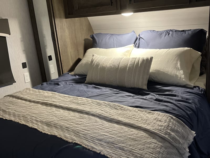 Queen bedroom with two closets and overhead storage. 