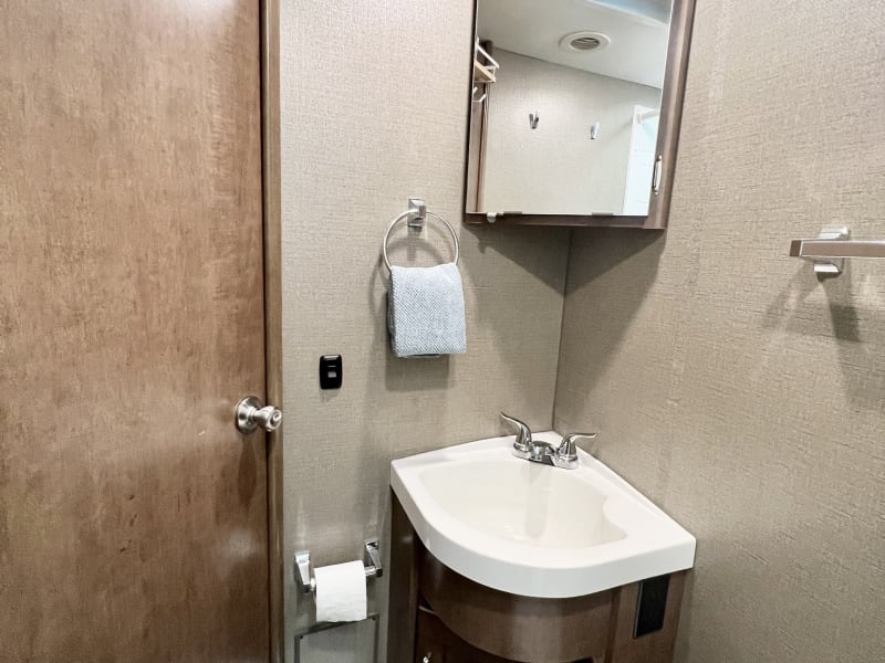 Medicine cabinet with first aid kit and deep bathroom sink