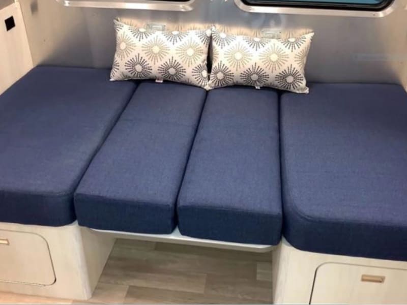 Dining table transitions into bed, reading nook or just a nice place to nap!