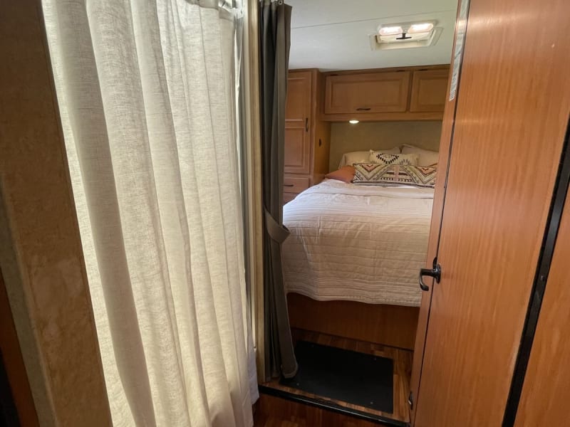 This is the entryway to back of the RV.  Shower on the left and restroom on the right.  The door can function as a privacy feature closing off Hall
