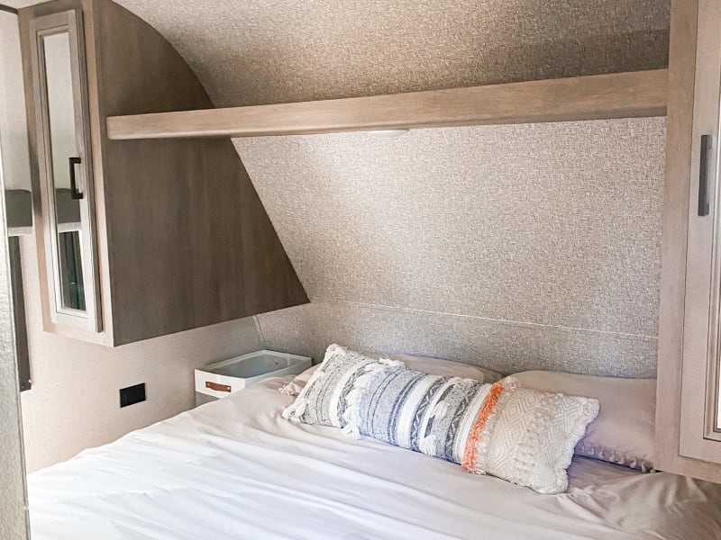 We have a super comfy queen size bed, with a TV and DVD player.
