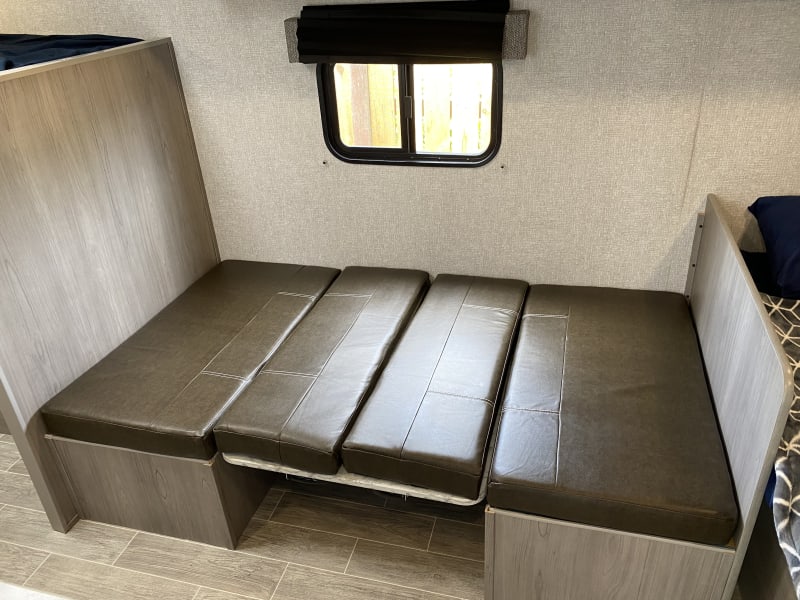The dinette folds into a bed.