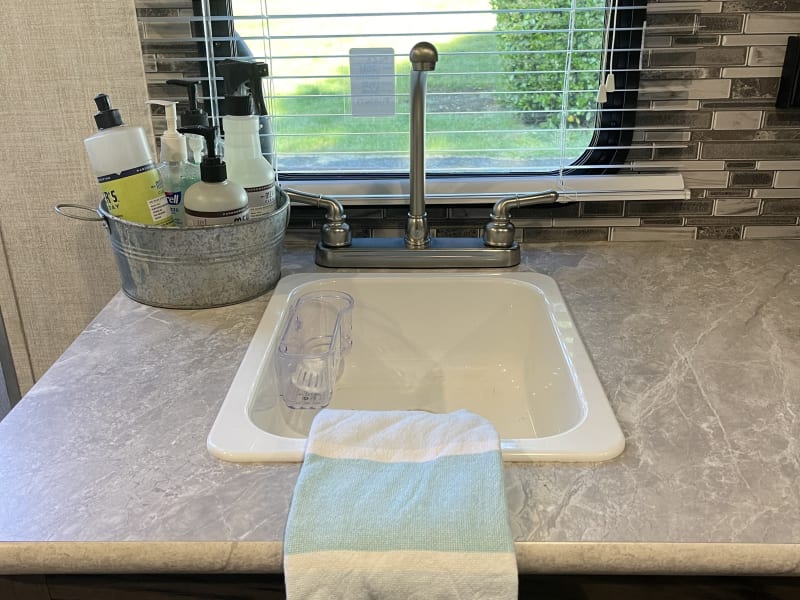 little sink with all you need to clean up and sanitize 