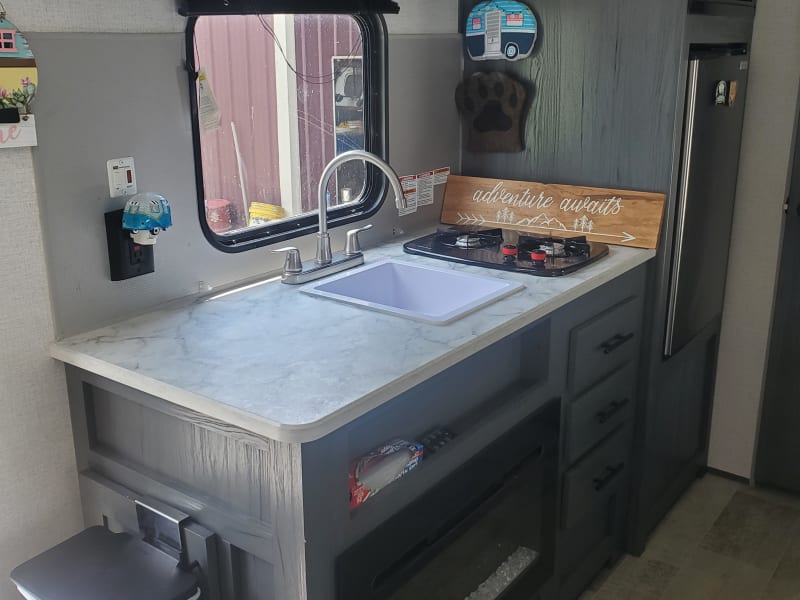 2 burner cook top, microwave, and fridge. 