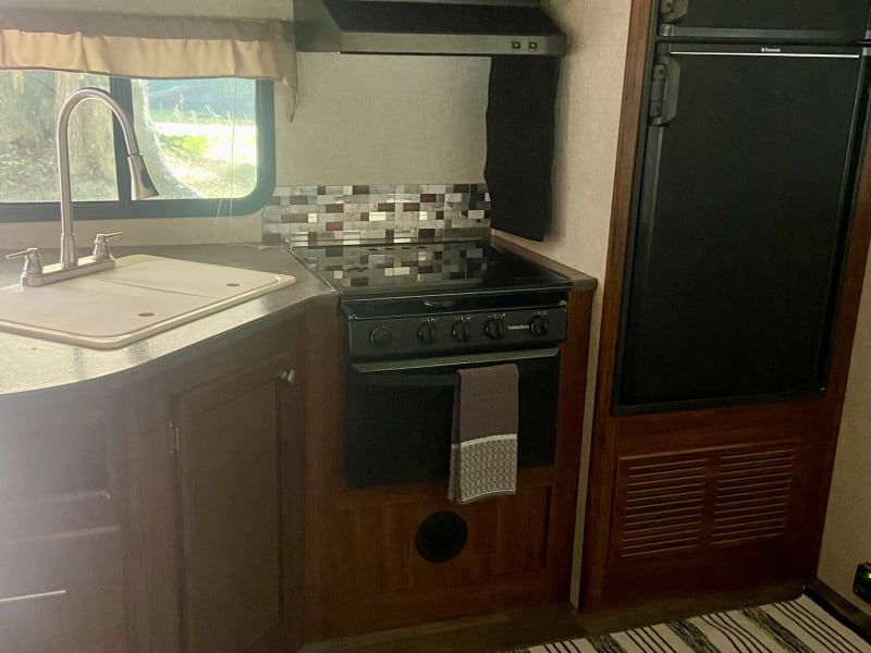 Kitchen with 3 burner stove
Double sink 