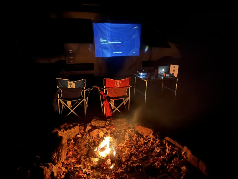 Use the projector to watch a scary movie or play games on your device in front of the campfire!