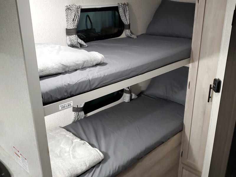 Over under bunk beds 250lb max weight limit, extra storage in side closet