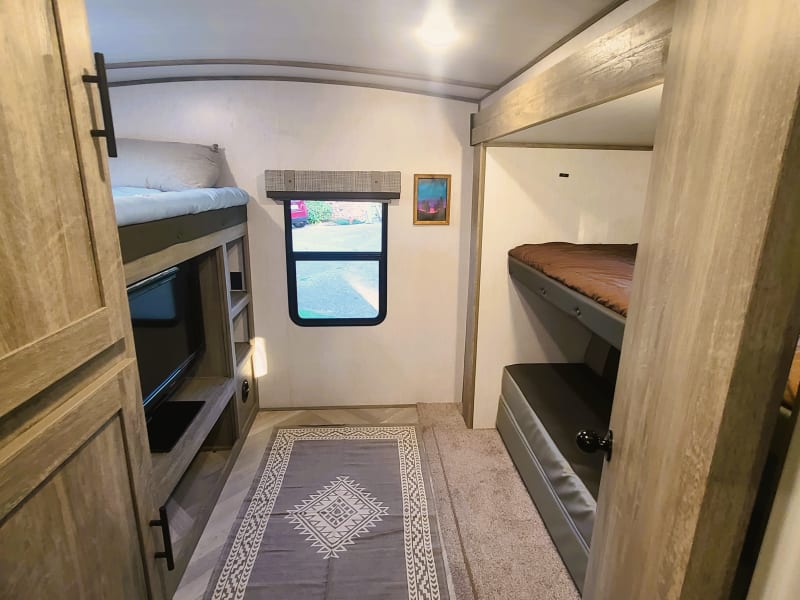 The rear bunkhouse is very spacious and has 2 bunks with a fold out couch as well. 