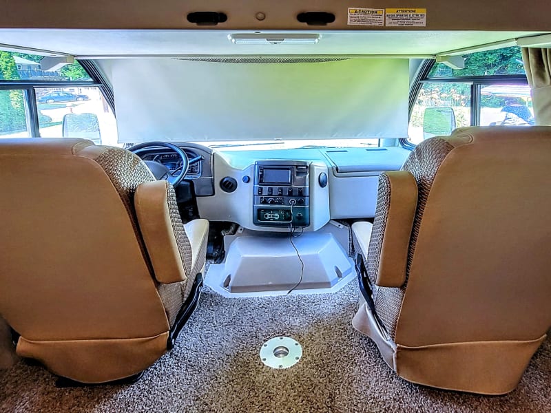 Between the seats is a perfect place for your furry friend!
