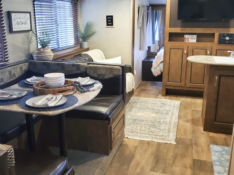 Dinette storage has pots & pans on one side and family games on the other. Couch storage is for any decorations or pillows you don't want in the way. 