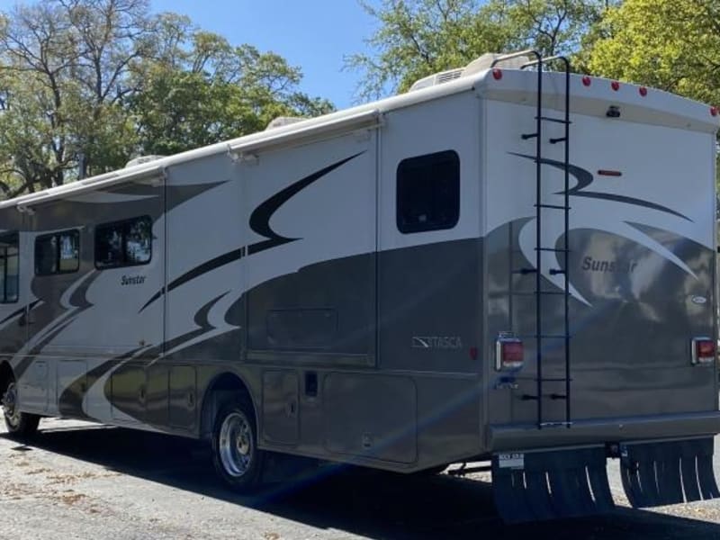 Outdoor shower compartment and tow hitch