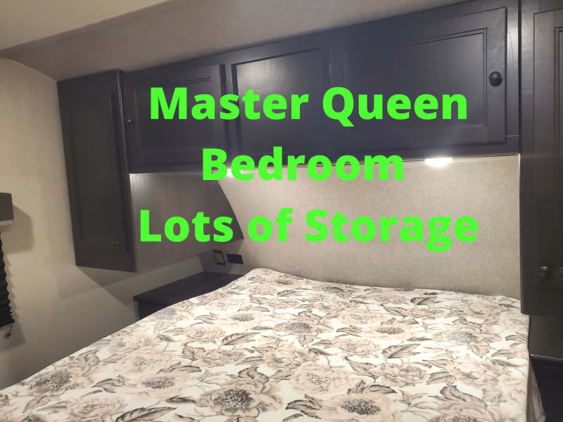 Master Queen for 2 adults with closets, storage above and underneath. Outlets next to beds.