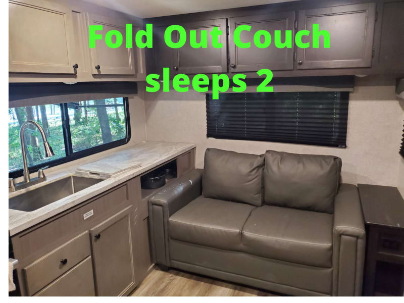Couch by day and fold out full size bed by night. Sleeps 2 adults comfortably