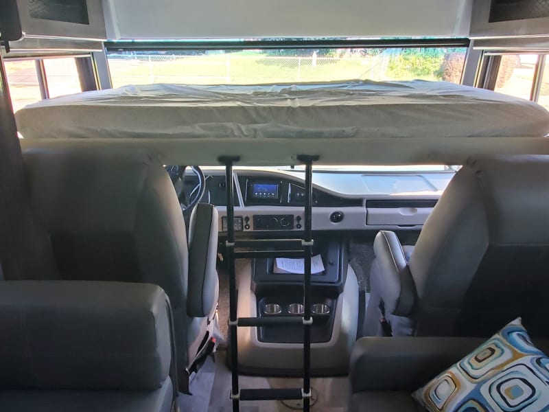 bunk above driving area, has electric controls. 