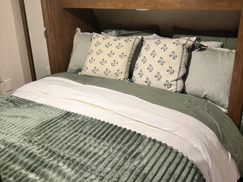 Master bed with residential pillowtop queen mattress