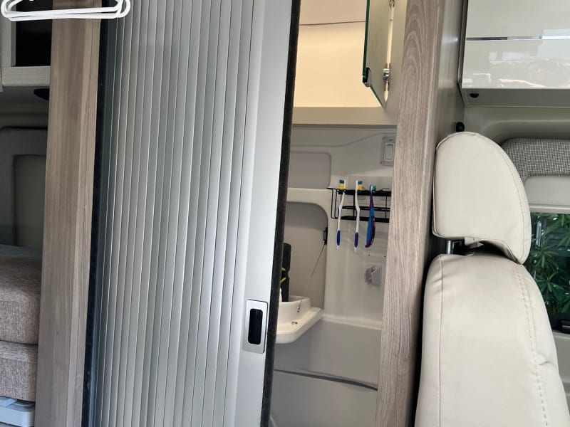 Rubber drying mat for drying dishes as well as place mat for light items place on to prevent from sliding out of place while the van is on the move.