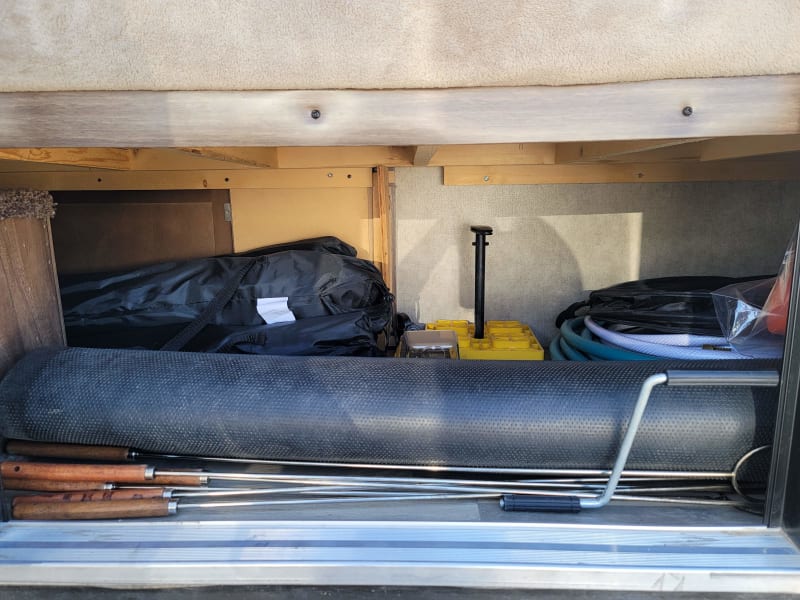Outside access to storage under the bottom bunk, and the accessories we provide with the trailer
