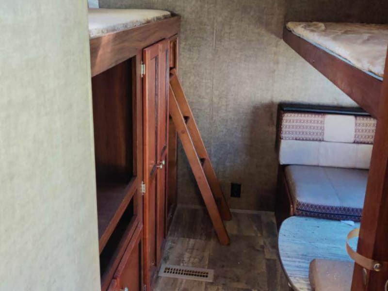 This is located in the back of the camper, 3 twin beds with closet and tv
