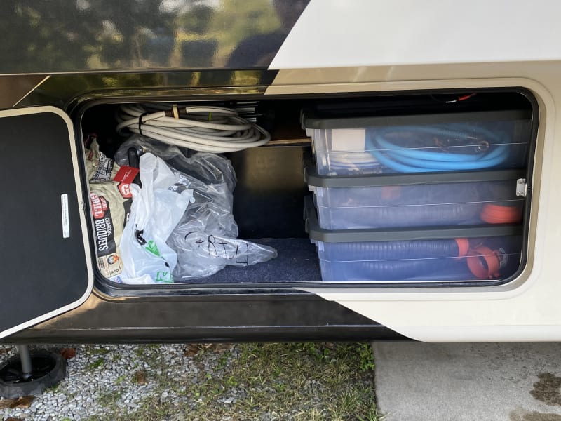 Both front and rear storage have an upper pass through for larger objects.