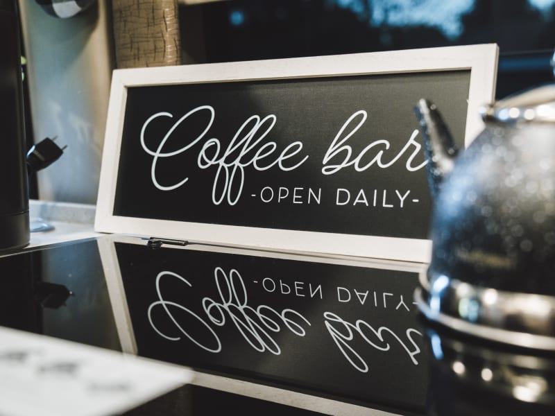 The Coffee Bar comes with a Keurig and completely coffee, cream, and sugar.