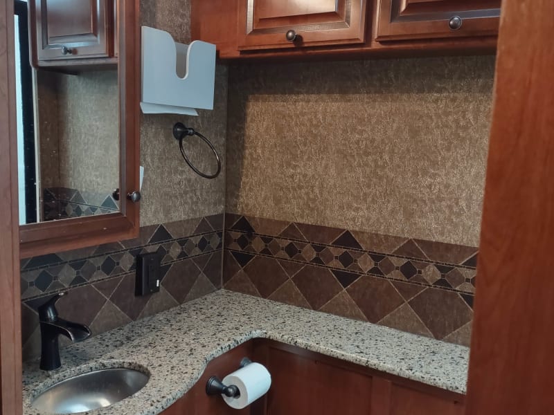 tons of counter space and storage cabinets in bathroom