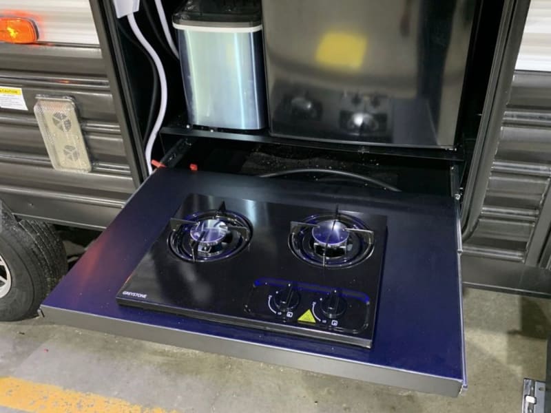 Outdoor gas stove, with mini fridge and ice maker. 