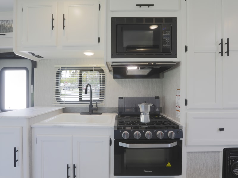 - A huge sink, so that all the dishes can get the same attention and care
- Three burners stove when you need to cook different meals at the same time