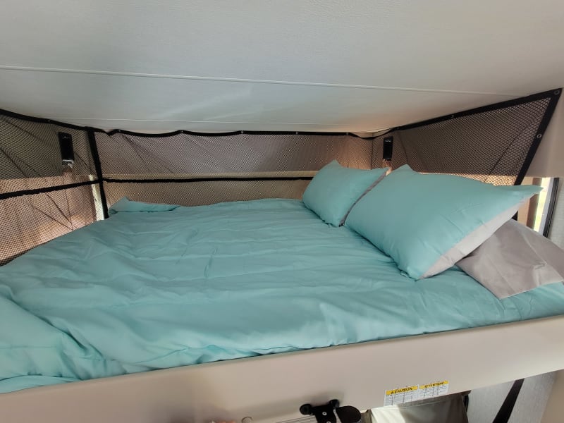 Full size bed over cab