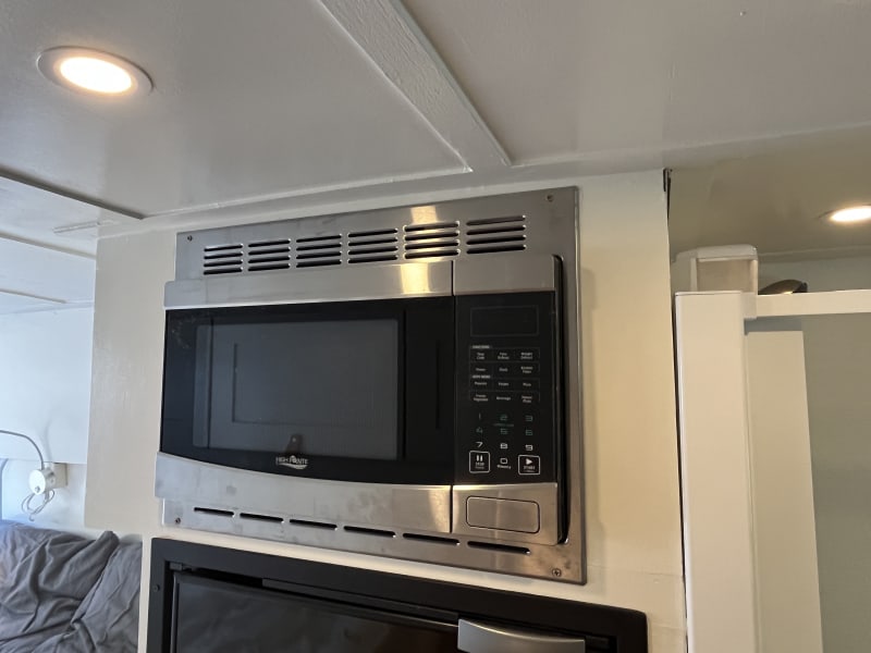 microwave above refrigerator and freezer