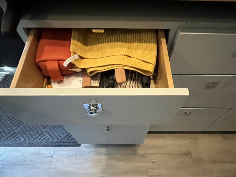 Push button knobs that keep drawers in place