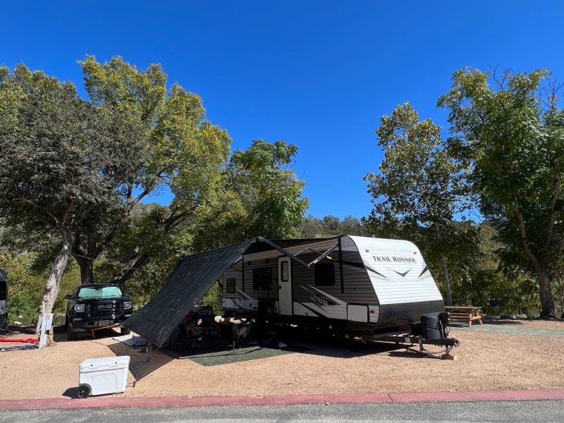 Outdoor chairs, rug and canopy provided with rental