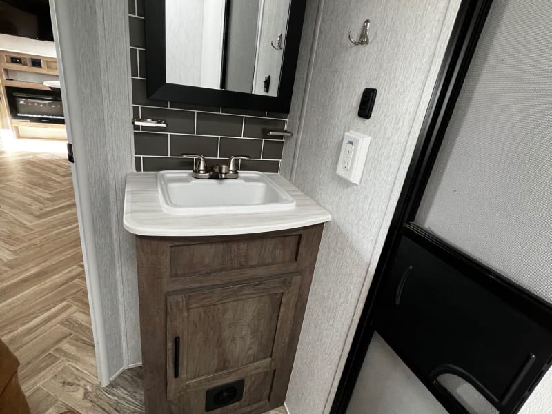 Includes rv toilet paper, hand soap, dry towel, and cleaning supplies. 