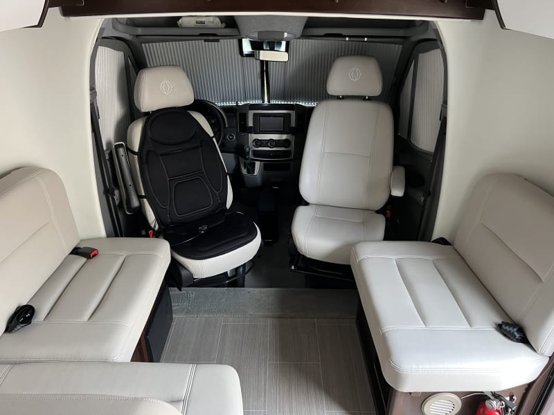 Integrated Privacy screens in front windows and windshield slide right out when your in camping mode!