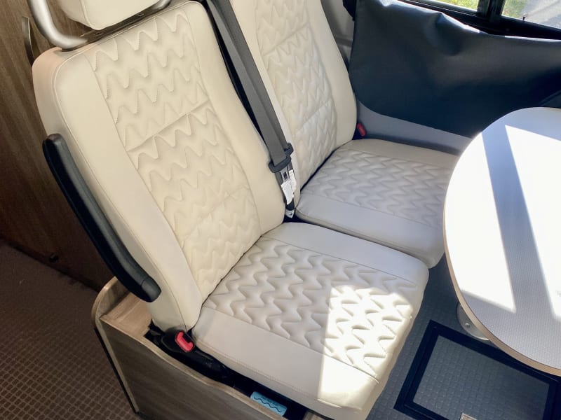 rear seats with safety belts and removable pedestal table