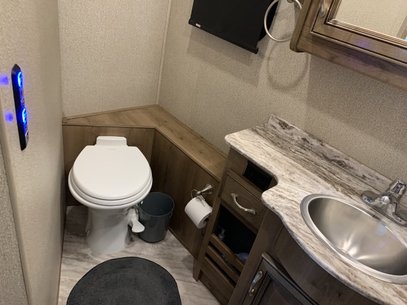 1/2 bathroom toilet. 
Cabinets above toilet 