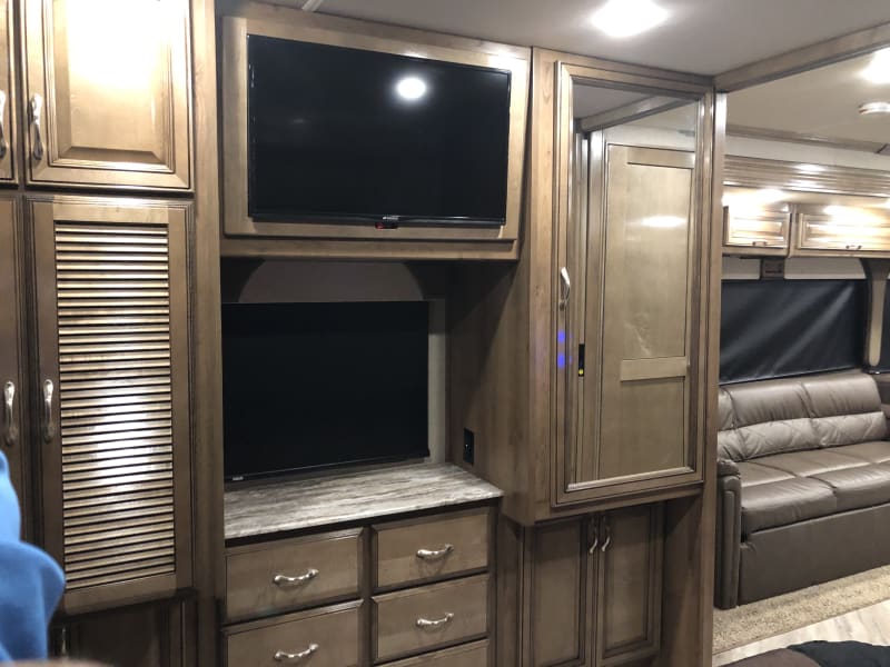 Master bedroom TV and Storage closets.  
Left side house the washer and dryer unit
right side is open storage closet 