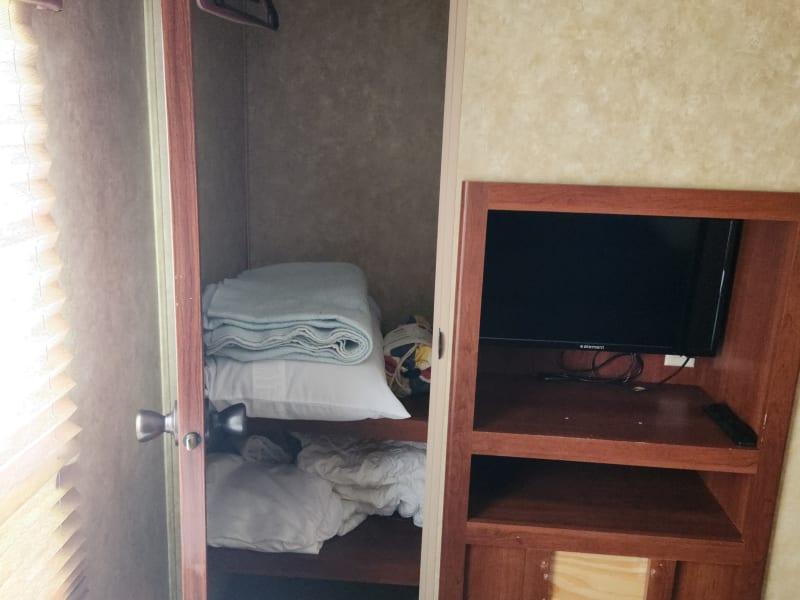 Bunkroom closet. Bedding provided for foldout couch.