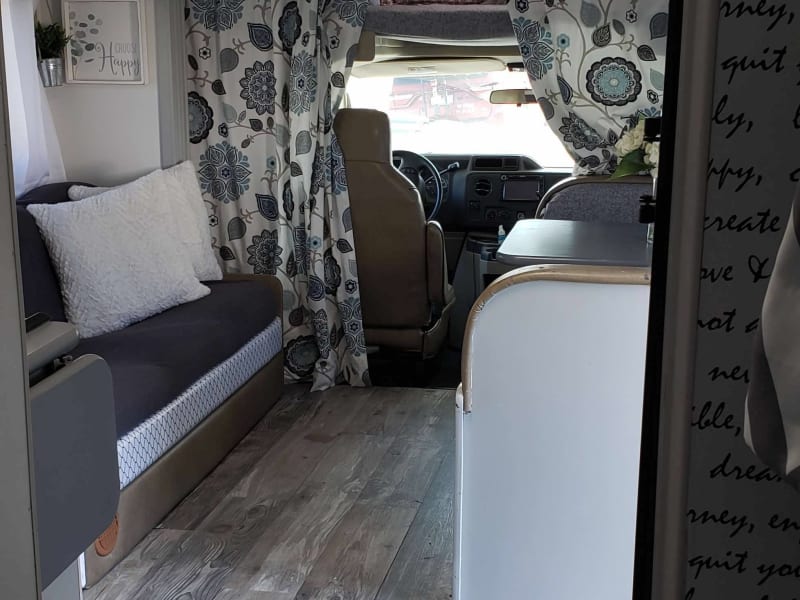 Double bed located above driving area.