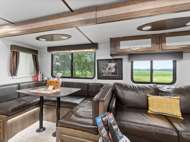 The RV has plenty of windows that can be opened by sliding each has a screen.