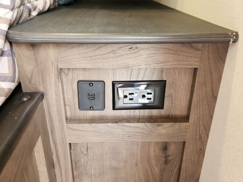 USBs and plugs near the couch/murphy bed for charging up.