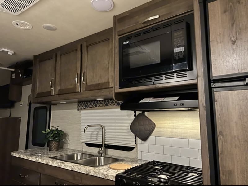Nice kitchen with large countertop space, convection/microwave oven, double sink.